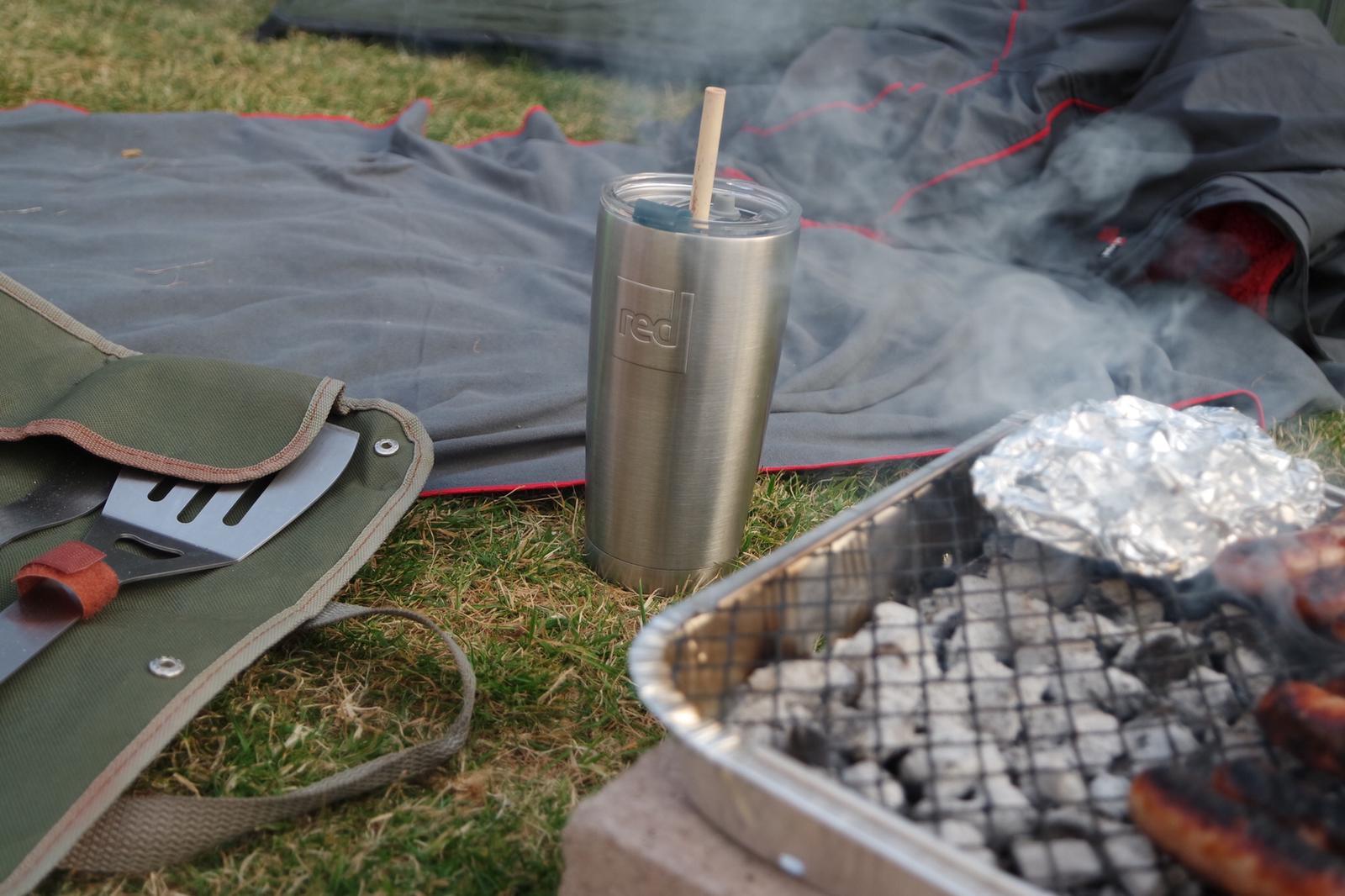 Travel Cup Next To A BBQ